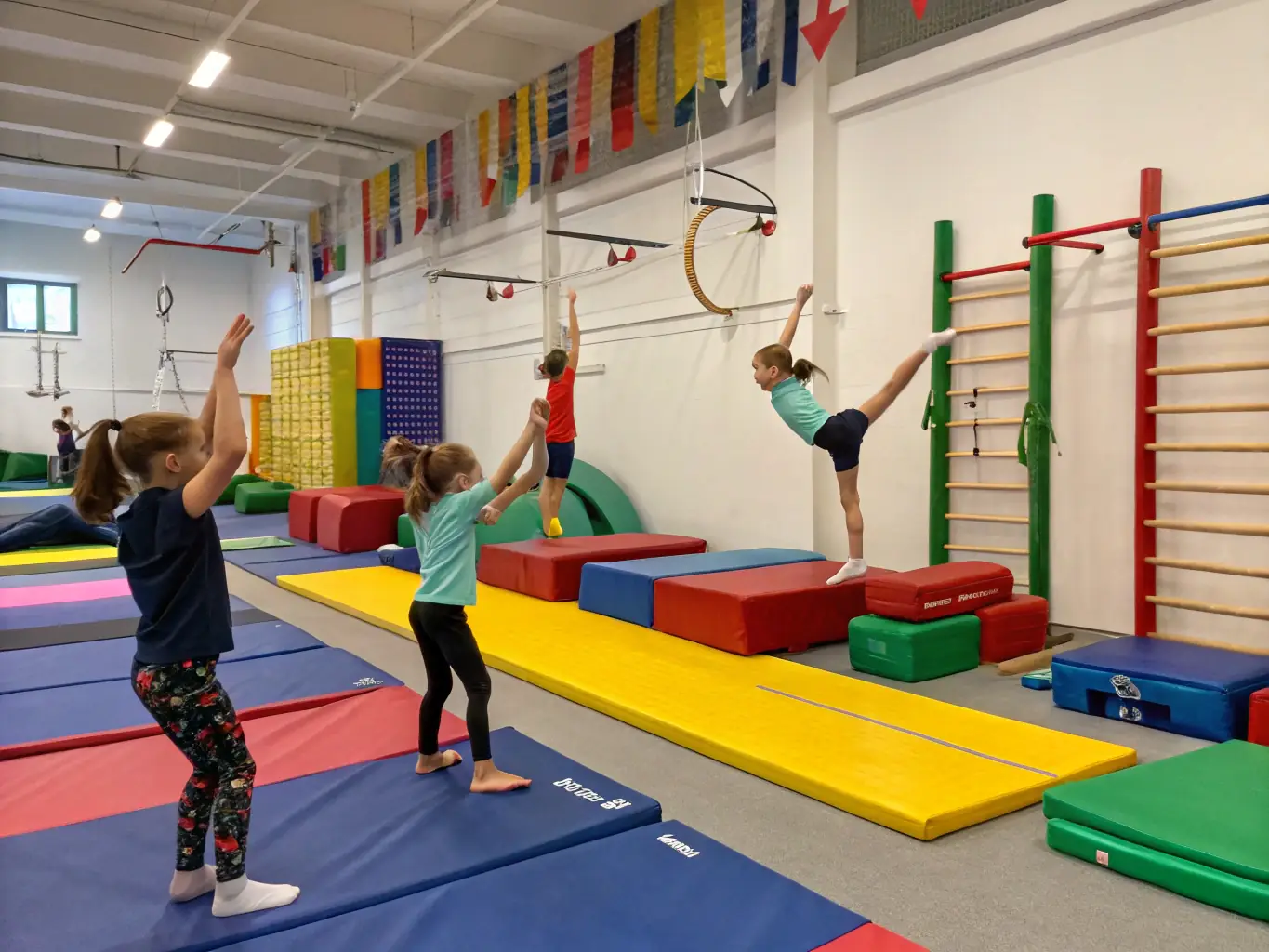 A vibrant image of children participating in a gymnastics class at ETOILE AUXONNAISE, showcasing flexibility and teamwork.